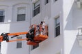Painting the Omni Mt Washington Hotel on a boom lift
