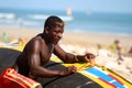 Man painting pirogue