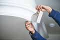 Painting and plasterwork. worker hand with spatula making molding Royalty Free Stock Photo