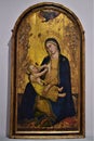 Painting, probably on wood, depicting the Madonna with the baby Jesus in her arms, in the gallery of the Accademia in Florence.