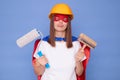 Painting profession. Renovation worker. Craftsman painter skills. Sad tired disappointed woman painter wearing superhero costume Royalty Free Stock Photo