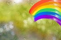 painting rainbow on glass, rain outside window, gouache, acrylic, creative development, happy childhood, symbol LGBT movement, Gay