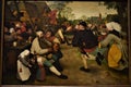 Painting representing people dancing in the village street, painted by Pieter Bruegel, at the Kunst Museum in Vienna. Royalty Free Stock Photo