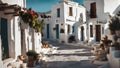 painting of a traditional greek village street with ancient white houses and potted plants in summer sunlight