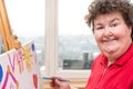 Painting Therapy with a mentally disabled woman Royalty Free Stock Photo