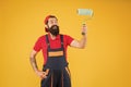 Painting tool. Brush roller painter. Decoration and decor. Man bearded laborer painting in workshop. Repair and Royalty Free Stock Photo
