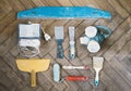 Painting tools and accessories on wooden floor, putty knifes, paint roller, brushes, respirator