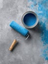 Painting Tools on a Concrete Surface With Bright Blue Paint and Roller Ready for a Fresh Makeover Project Indoors or Royalty Free Stock Photo