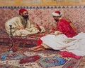 Painting of traditional Egyptian scene of two men smoking water pipes