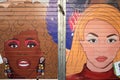 Whitney and Brittany painting on bar exterior