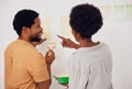 Painting, wall or happy black couple in DIY, home renovation or house remodel together with a paintbrush. Back view Royalty Free Stock Photo