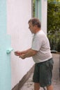 Painting wall with a roll in green Royalty Free Stock Photo