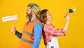 Painting walls. Cheerful couple renovating house. Woman builder. Man painter or decorator. Interior renovation Royalty Free Stock Photo