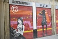 Painting of women on telephone store door