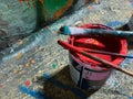 Painting and writing on a public wall, making graffiti in the street with colorful cans of paint_street art concept Royalty Free Stock Photo