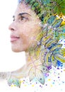 Paintography. Double exposure profile of a young natural beauty, with face and hair combined with colorful hand drawn leaves Royalty Free Stock Photo