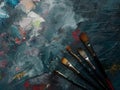 Paints and brushes, background with copy space in the middle, influenced by paint palette, brushes Royalty Free Stock Photo