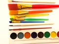 Paints and brushes. Composition of brushes and paints for the artist. Royalty Free Stock Photo