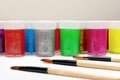 Paints and brushes on the table with copy space for text. Crafts, arts and hobby concept Royalty Free Stock Photo