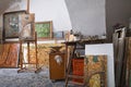 Paints and Canvases in Artist`s Studio