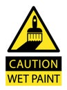 Caution, wet paint. Yellow triangle sign with paintbrush and text