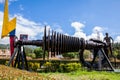 Beautiful industrial art sculpture by Jose Medardo Leguizamo of a man using coal to generate