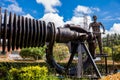 Beautiful industrial art sculpture by Jose Medardo Leguizamo of a man using coal to generate