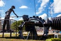 Beautiful industrial art sculpture by Jose Medardo Leguizamo of a man using coal to generate