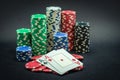 Pair of ace winner, poker chips stacked and pair of aces, black background Royalty Free Stock Photo