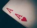 A pair of aces on a black background. Macro shot texture of playing cards. Ace of hearts and ace of diamonds. Nuts hand Royalty Free Stock Photo