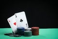 A pair of aces on a deck of playing cards. Poker playing chips on a green table. Online gambling. Addiction. Playing cards Royalty Free Stock Photo