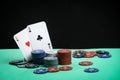 A pair of aces on a deck of playing cards. Poker playing chips on a green table. Online gambling. Addiction. Playing cards Royalty Free Stock Photo