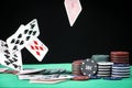 A pair of aces on a deck of playing cards. Poker playing chips on a green table. Online gambling. Addiction. Playing cards Royalty Free Stock Photo