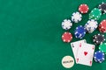 Pair of aces and poker chips on green background whit copy space Royalty Free Stock Photo