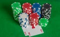 Pair aces and poker chips stack on green table Royalty Free Stock Photo