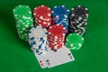 Pair aces and poker chips stack on green table Royalty Free Stock Photo