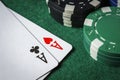 A pair of aces on the table with poker chips Royalty Free Stock Photo