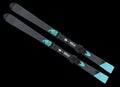 Pair of alpine skis isolated on black background. Sport equipment for skiing