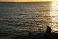 A pair of anglers in the sunset