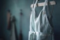 a pair of aprons hanging on a clothes rack in a room Royalty Free Stock Photo