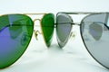 A pair of aviator sunglasses against each other, isolated on a white background Royalty Free Stock Photo