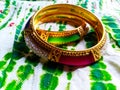 Pair of bangles incorporated with pink and green stones