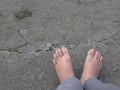 bare foot in the aspalt background