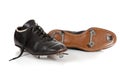 Pair of baseball cleats on white