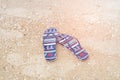 Pair of beach sandals on the sand Royalty Free Stock Photo