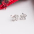 A pair of beautiful 925 sterling silver earrings in flower shape Royalty Free Stock Photo