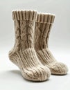 Pair of Beige Knitted Wool Socks on White Background Detail Shot Royalty Free Stock Photo