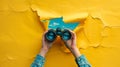 A pair of binoculars emerges through a torn yellow paper against a blue background.. AI generated Royalty Free Stock Photo