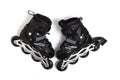 Pair of black children roller skates on white background, representing fun, activity, and youthfulness.