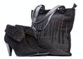 Pair of black female suede boots and suede bag Royalty Free Stock Photo